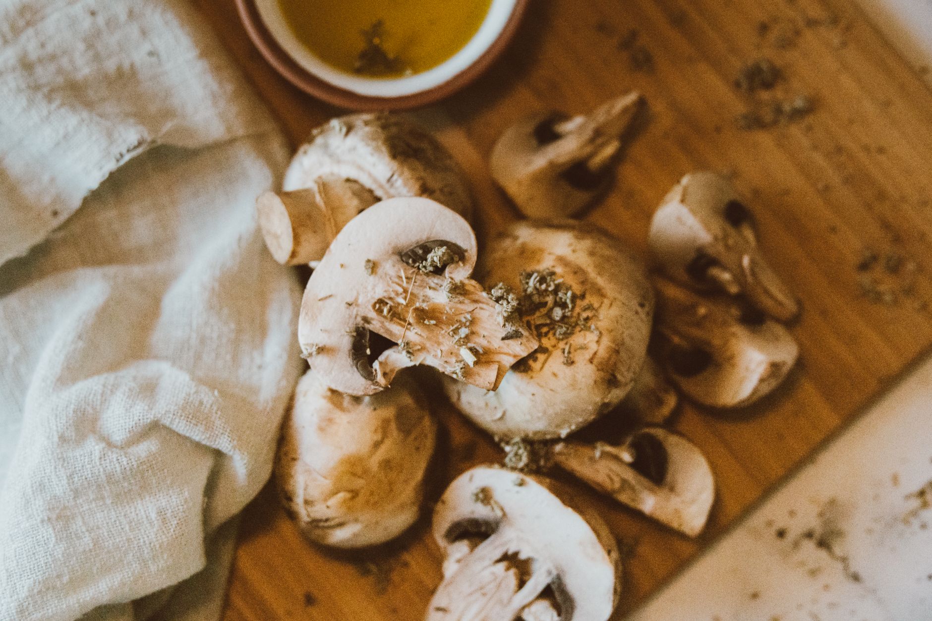 fresh hen of the woods cluster on a wooden cutting board